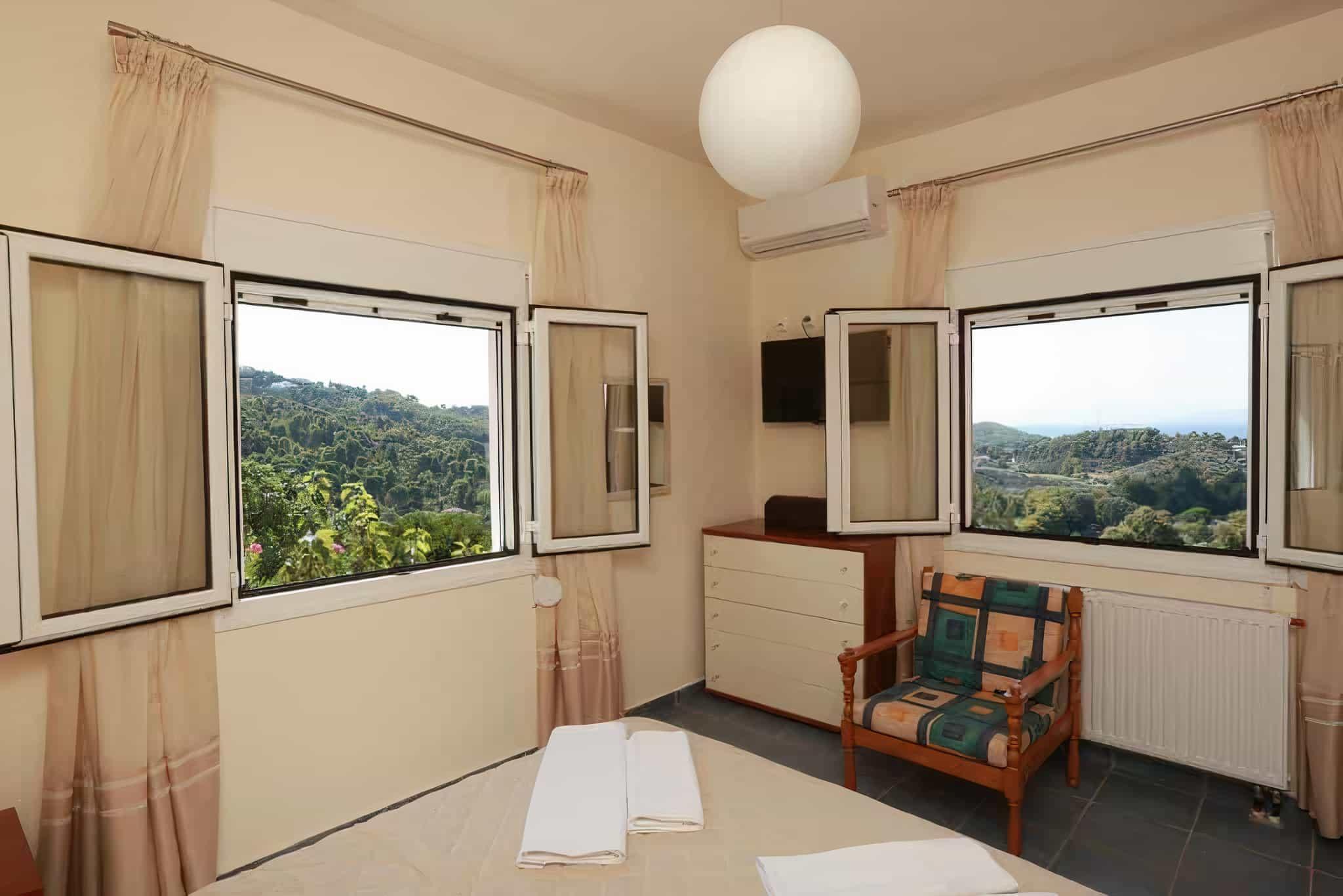 Villa Anemoessa living room with balcony and sea view